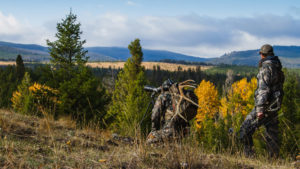 hunters on ridge with spotting scope