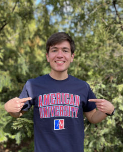 Diego Tovar in an American University shirt with trees behind him. 