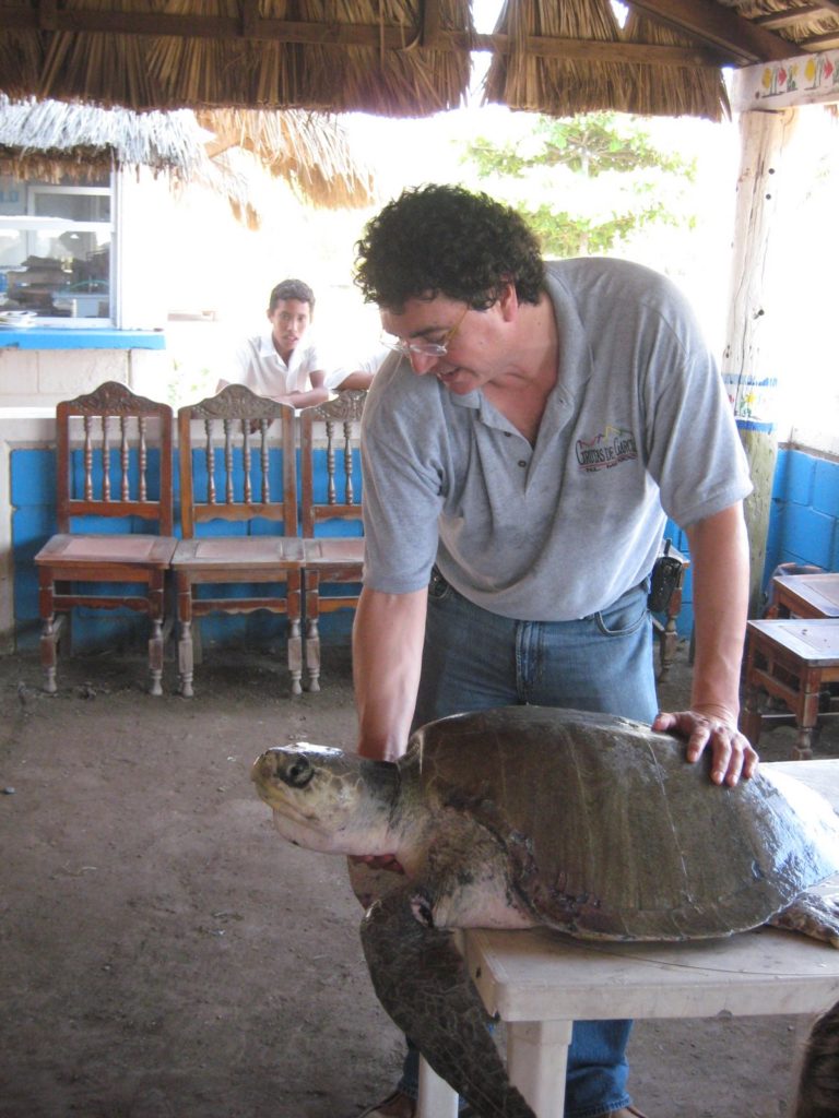 Dr. Aguirre illustrating a point using sea turtle during course for school children