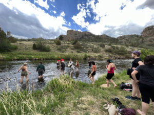 Colorado high school students enter the stream after their guided hike with CNHP at Phantom Canyon.