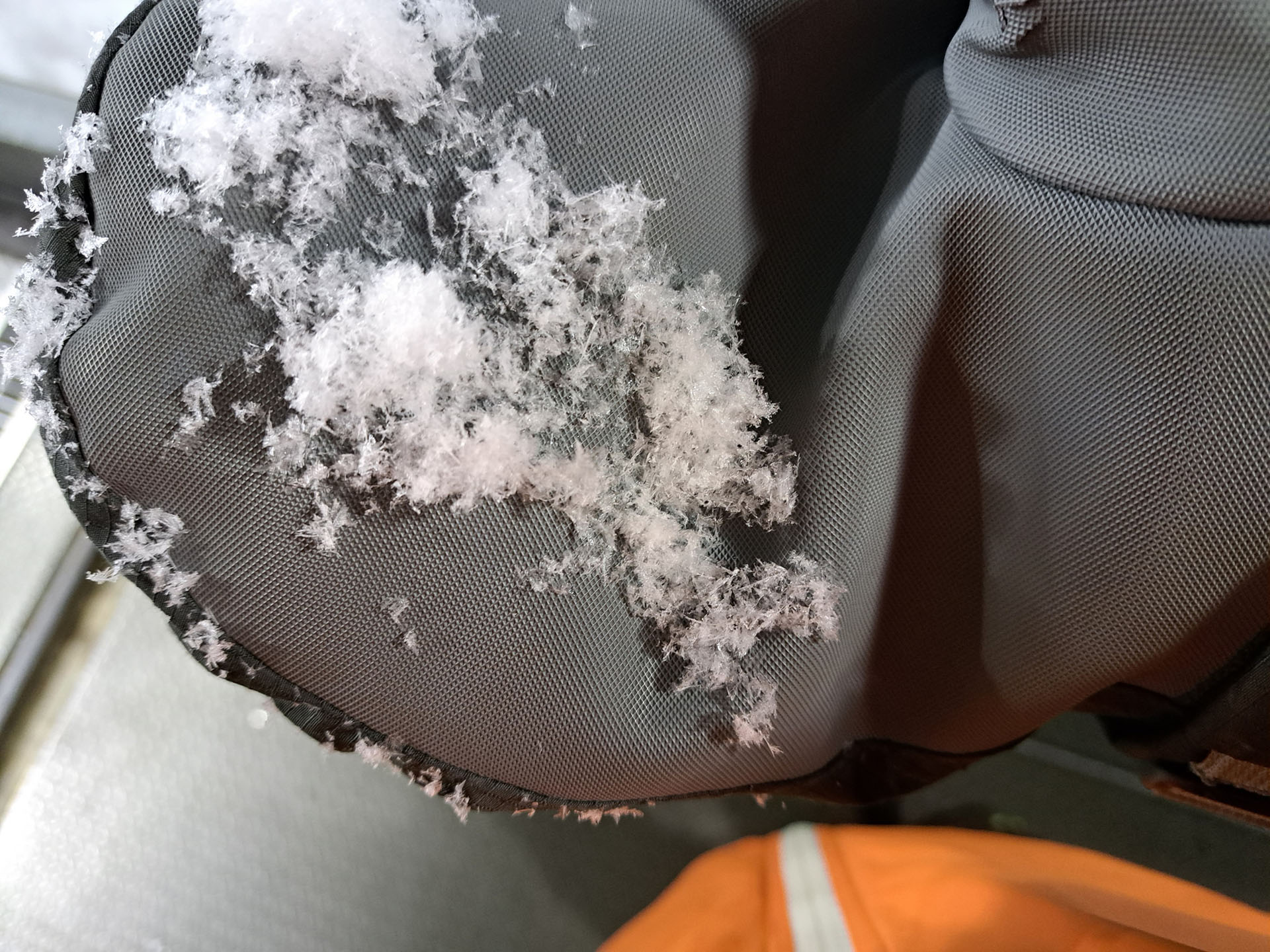 closeup of snowflakes on a mitten