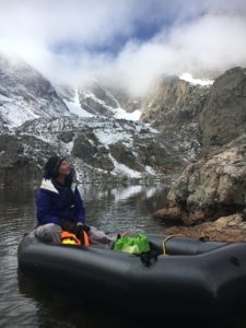 Jill Baron in a raft in the mountains