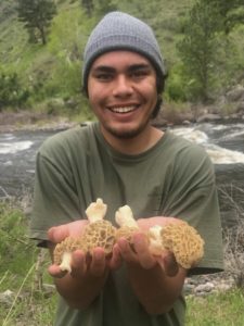 Narby holding his first white morels up the Poudre Canyon. Narby is an avid forager, angler, and hunter.