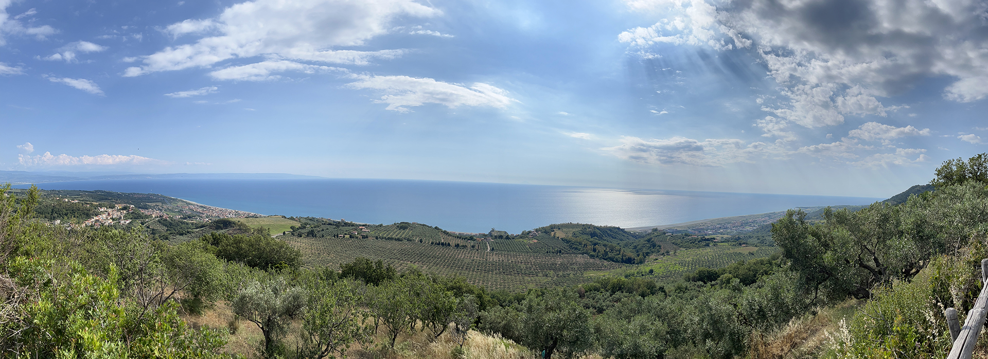 Calabrian landscape overlooking the Tyrrhenian Sea with a marine terrace in the foreground (flat area)